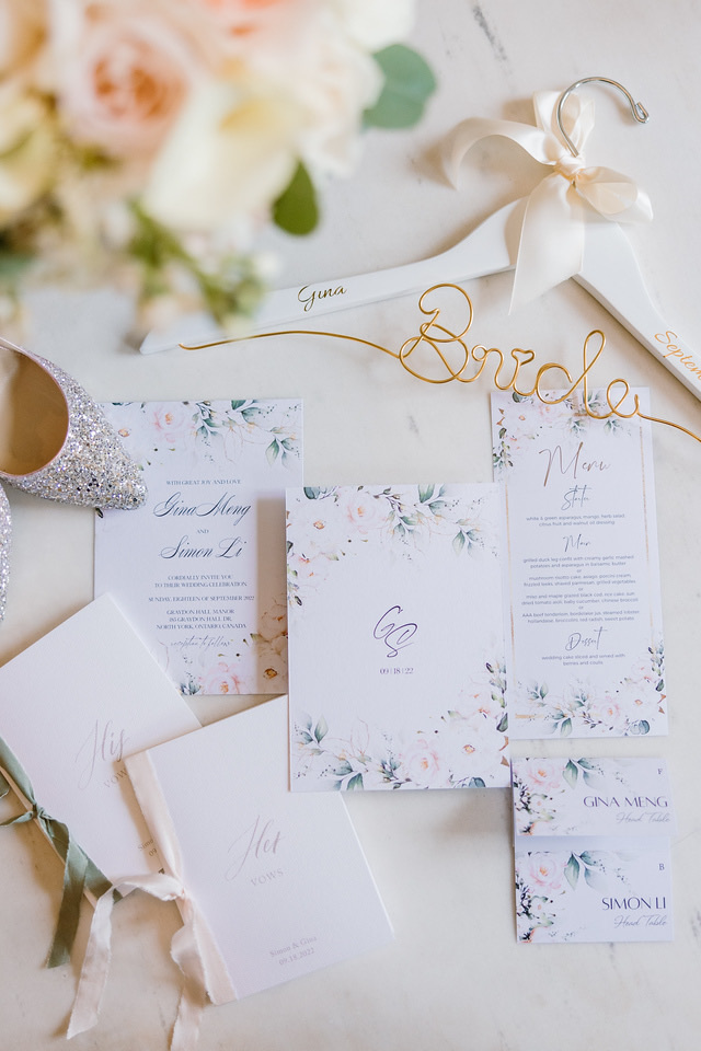 An invitation suite, envelope and ribbon.